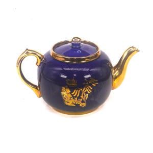 Bule de chá Chinoiserie vintage Sudlows de 1900, em cobalto e ouro. Tema pagode. Defeito.