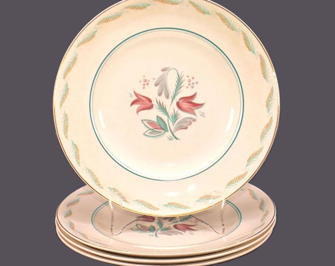 Four Wedgwood Fanfare dinner plates. Albert Wagg design made in England.