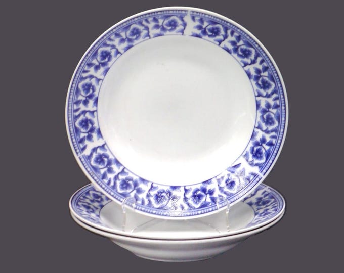 Three Royal Heritage Country Cottage blue-and-white floral toile rimmed soup bowls.