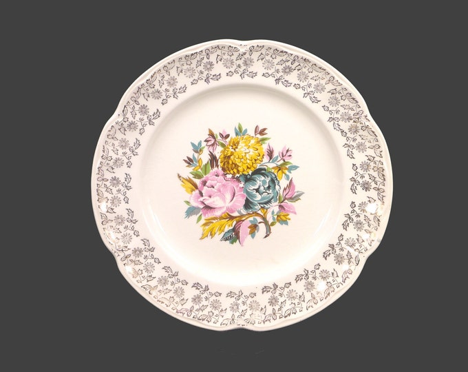 Sovereign Potters SVP31 | 1182-53 dinner plate. Central flowers, gold filigree rim. English ironstone decorated in Canada. Sold individually