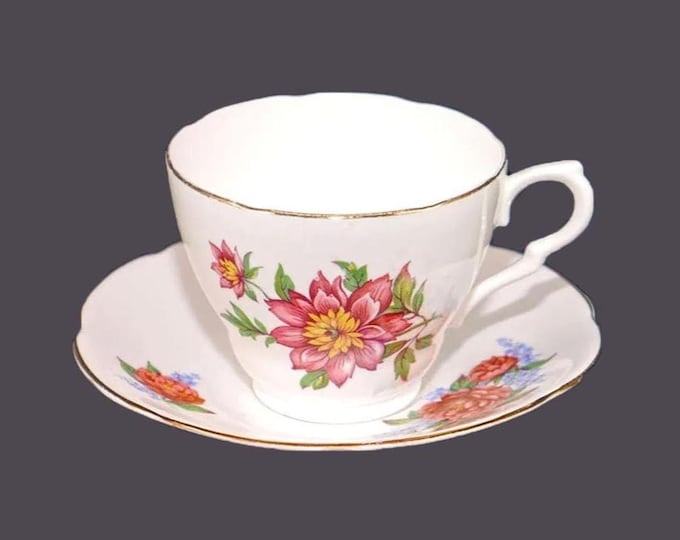 Genuine Bone China | Colclough tea set made in England. Pink camellias with yellow stamen and greenery.