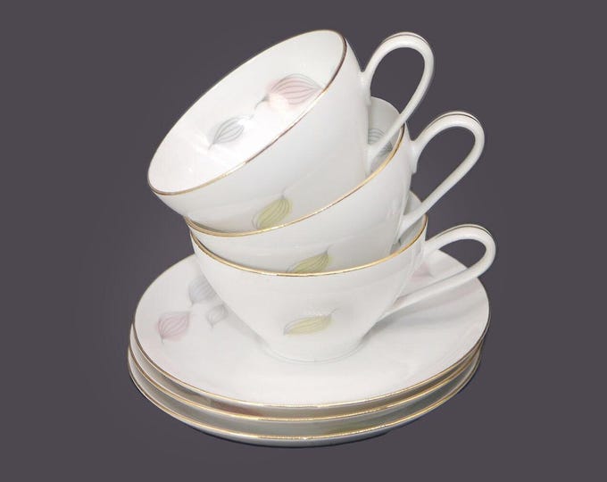 Three Thomas Germany 2002 wide-mouth cup and saucer sets. Multi-color leaves.