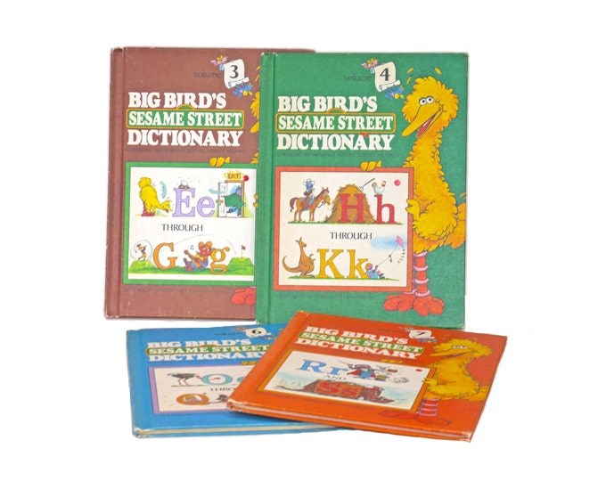 Four volumes of Big Bird's Sesame Street Dictionary Volumes 3, 4, 6, 7.