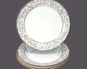 Vintage Holiday Joy Spal Plaza dinner plates. Gold scrolls on white. 4 plates.