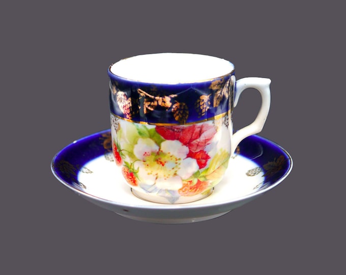 Antique Kaiser hand-painted demitasse cup and saucer set made in Germany. Flaws (see below).