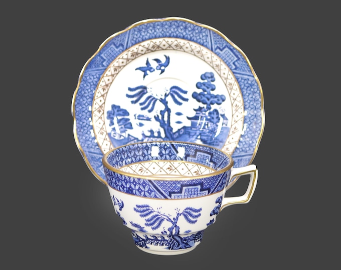 Booth's Real Old Willow A8025 cup and saucer set. Blue-and-white Chinoiserie made in England. Flaw (see below).