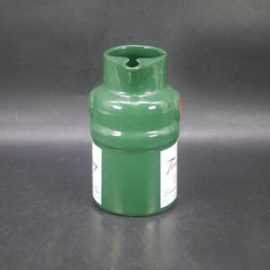 May include: Green ceramic pitcher with a red dot and the text "Tanqueray" in white lettering. The pitcher is shaped like a bottle.