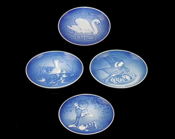 Four Bing & Grondahl Royal Copenhagen decorative wall plates. Mothers Day 1970, 1973, 1976 and Children's Day 1985. Made in Denmark.