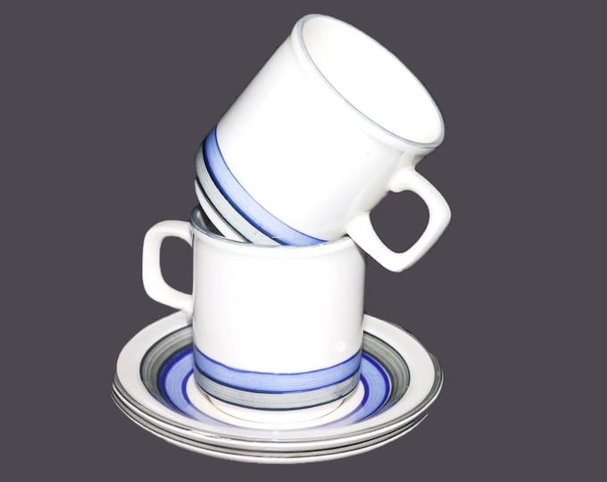 Pair of Carrigaline Pottery blue and gray striped stoneware cup and saucer sets made in Ireland.