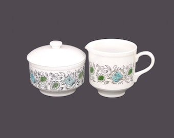 Retro Biltons creamer and covered sugar bowl. Teal green and black leaves on white. Made in England.