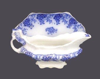 Antique Johnson Brothers Claremont flow-blue gravy boat and under plate made in England.