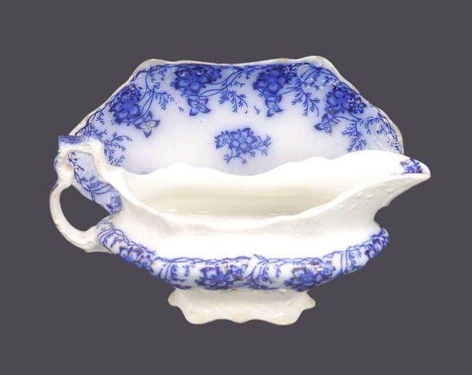 Antique Johnson Brothers Claremont flow-blue gravy boat and under plate made in England.