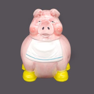Vintage Living Art cookie jar with vacuum-seal lid. Pink pig with bib and yellow boots. Too cute kitchen decor.