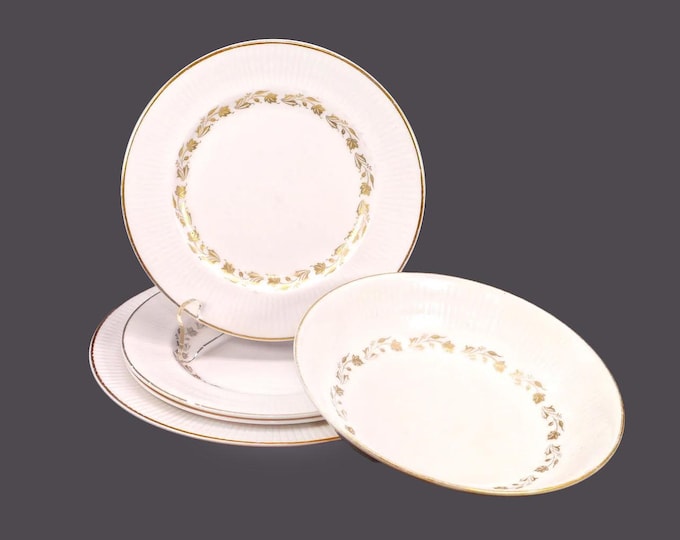 Royal Doulton Fairfax TC1006 bone china tableware made in England. Four plates, one cereal bowl. Flaws (see below).