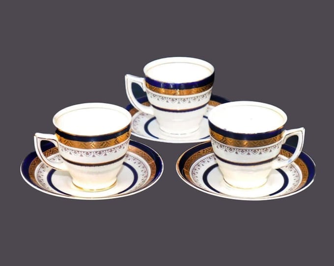 Three Myott The Crowning cobalt and encrusted gold demitasse sets made in England.