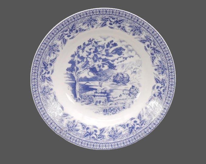 Royal Heritage Country Cottage blue-and-white toile rimmed soup bowl.