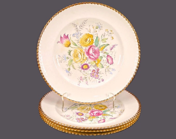Four British Empire Ware Breath O' Spring dinner plates. Flaws (see below).