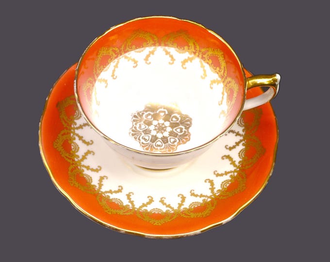 Aynsley 2331 bone china cup and saucer set made in England. Salmon, gold medallion center.