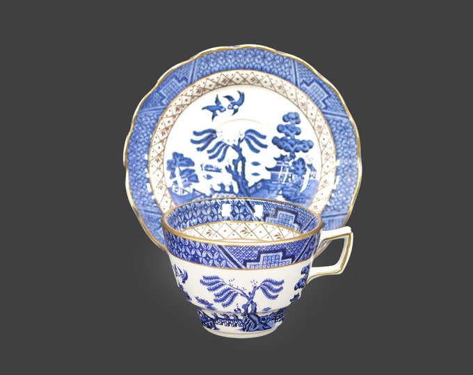 Booth's Real Old Willow A8025 cup and saucer set. Blue-and-white Chinoiserie made in England. Flaw (see below).