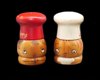 Mid-century Salty and Peppy hand-painted wooden salt and pepper shaker set. Chef's hat screws off to fill. Made in Japan.