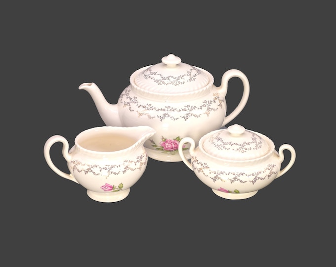 British Empire Ware Sovereign Potters Rosebud tea service. Four-cup teapot, covered sugar bowl, creamer. Florals and filigree.