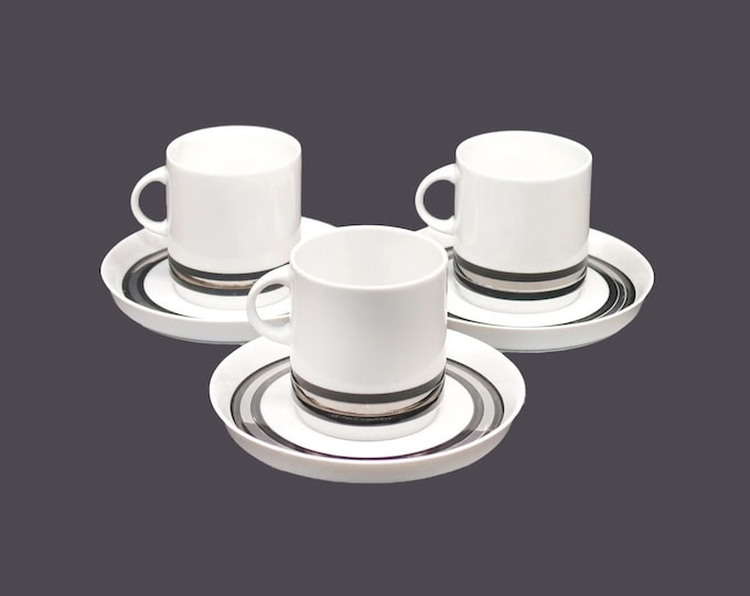 Three Thomas Germany THO392 cup and saucer sets. Flaw (see below).