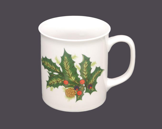 Ceramic Christmas coffee or tea mug. Holly, berries, pinecones. Attributed 1980s Japan manufacture.
