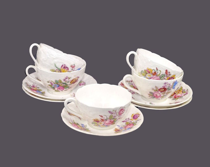 Five antique art-nouveau era Coalport 8417 Sevres-style cup and saucer sets. Bone china made in England. Multi-motif florals.