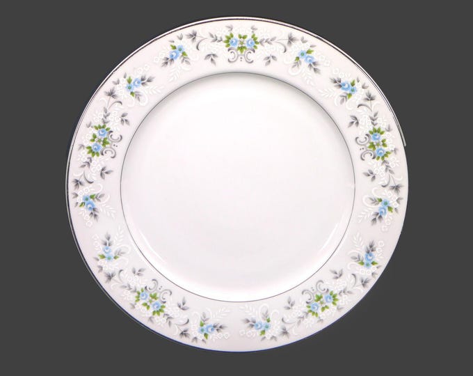 Sakura dinner plate. Blue roses, white embossed flowers, gray leaves and scrolls. Made in Japan. Sold individually.