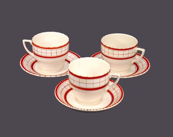 Three British Anchor Cottage Red folk-art cup and saucer sets made in England. Flaws (see below).