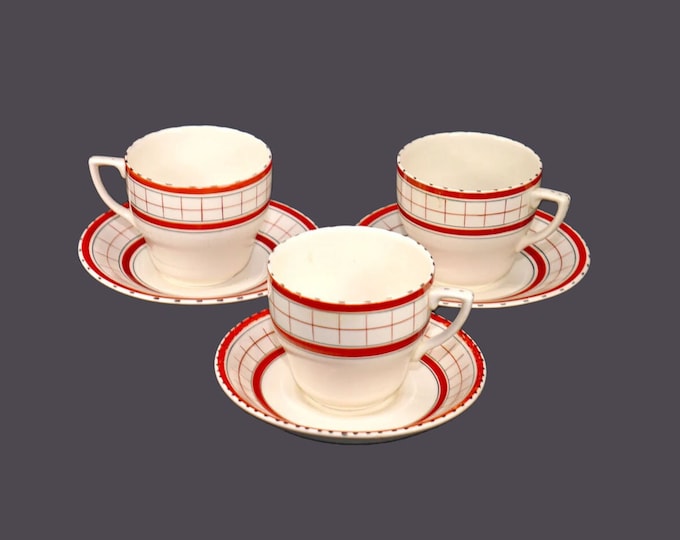 Three British Anchor Cottage Red folk-art cup and saucer sets made in England. Flaws (see below).