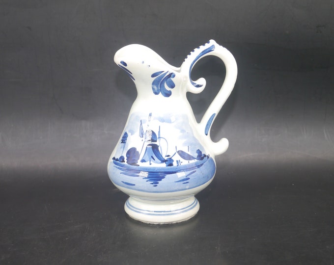 Hand-painted Delft jug made in Holland. Traditional Windmill and sailboat scene. Flaw (see below).