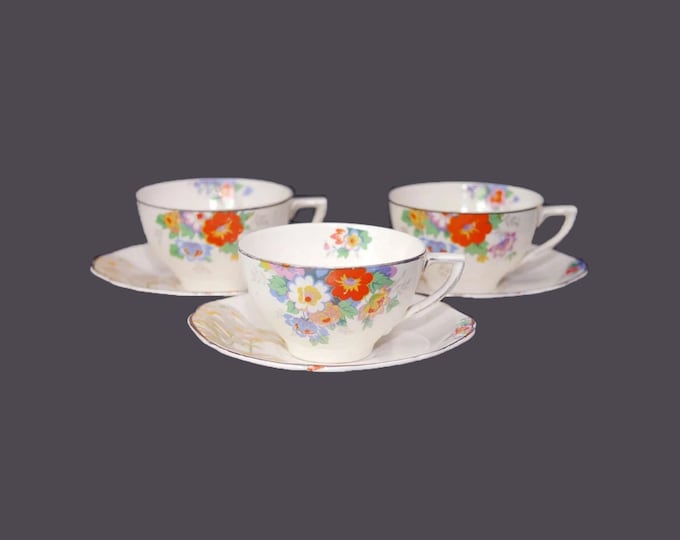 Three Hollinshead & Kirkham Montrose cup and saucer sets made in England. Flaw (see below).