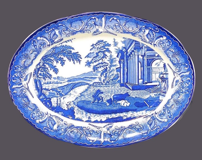 Blue-and-white large oval turkey platter made in Japan. Fisherman with dogs.