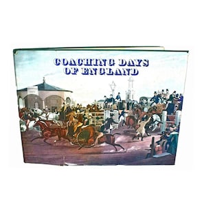May include: A vintage book cover featuring a colourful illustration of a horse-drawn carriage race. The title of the book is "Coaching Days of England".