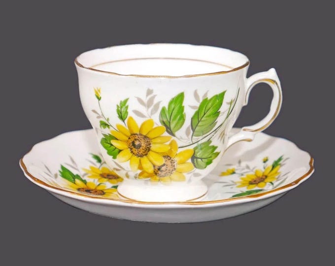 Royal Vale bone china cup and saucer set made in England. Sunflowers and greenery.
