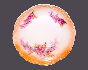 German lusterware round serving platter. Roses, orange luster, embossed details. Flaw (see below).