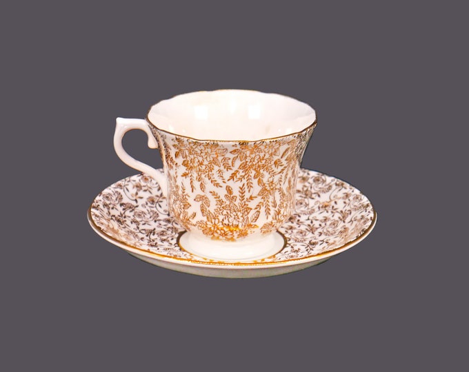 Mismatched gold chintz tea set of Royal Vale cup and Windsor Bone China saucer made in England.