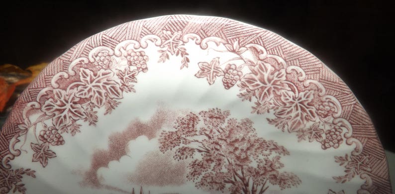 landscape scene. Red transferware bread-and-butter or side plate Vintage 1982 Tudor cottage Myott The Brook Pink