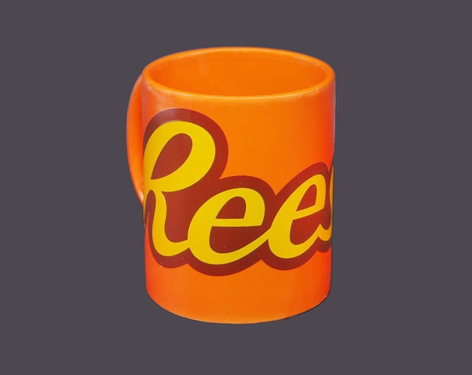 Reese's chocolate mug. Orange, brown and yellow lettering. Made by Galleria.