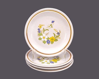 Four Nikko Mayflowers stoneware salad plates. Color Stone stoneware made in Japan. Minor flaw (see below).