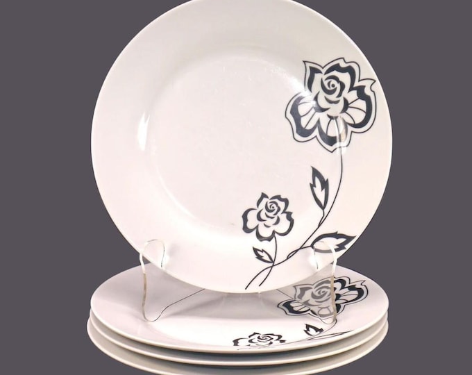 Vintage Moda dinner plates made by Oneida. Black flowers on white. 4 plates.