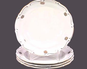 Four Walbrzych rimmed soup bowls. Gold florals, embossed rim. Made in Poland.
