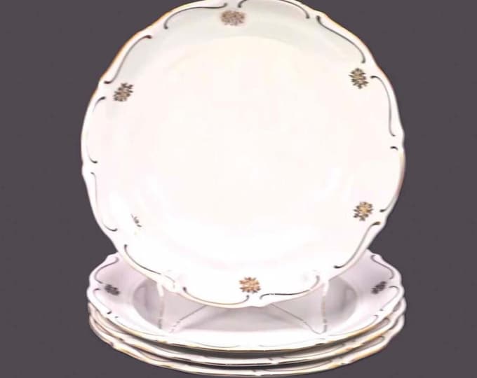 Four Walbrzych rimmed soup bowls. Gold florals, embossed rim. Made in Poland.