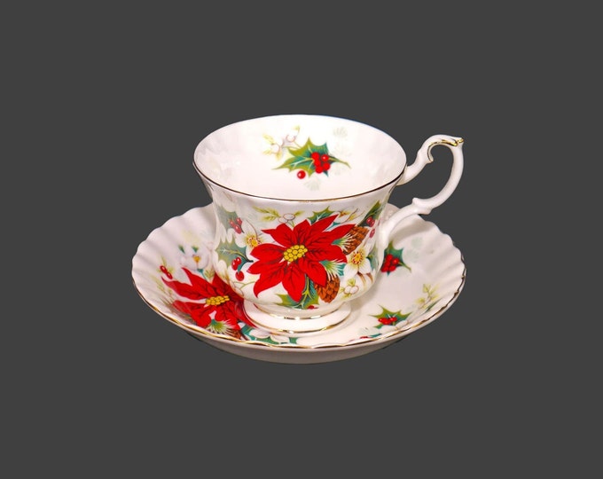 Royal Albert Poinsettia Christmas cup and saucer set. Bone china made in England.