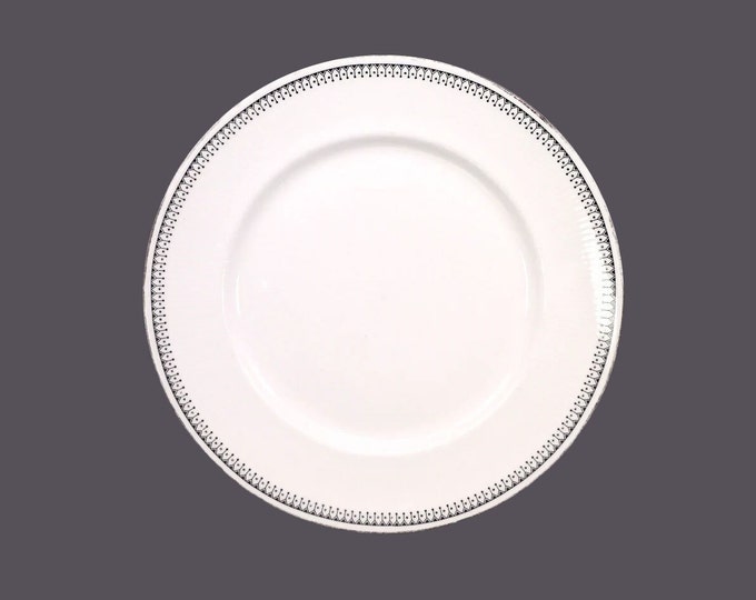 Paragon Olympus bone china dinner plate made in England. Flaw (see below). Sold individually.
