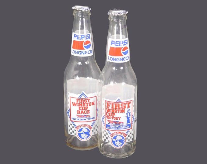 Pair of Pepsi longneck Nascar bottles with caps. Richard Petty Winston Cup Race.