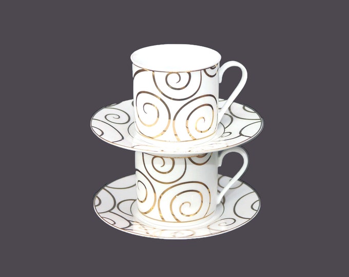 Pair of Gold Swirl cup and saucer sets. Gold scrolls on white. Exclusive to Pier 1 in Canada.