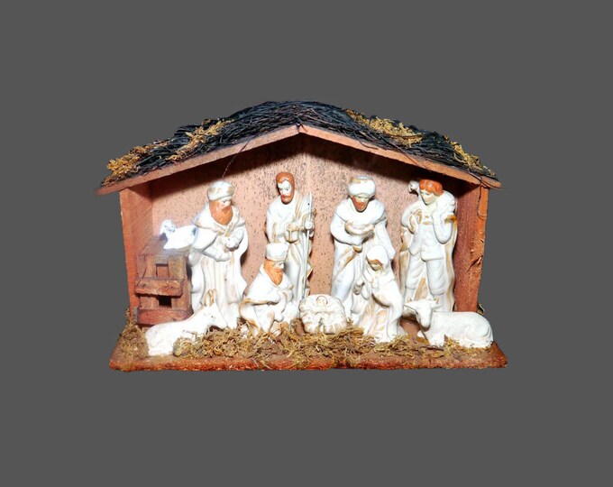 Nativity Set | creche scene. Ten porcelain figures wooden shed thatched roof. Figures are fixed in place. EBCI Imports.