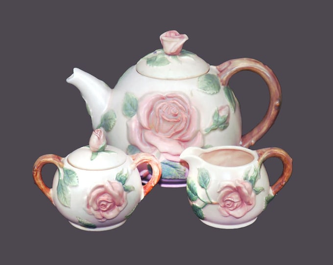 Fitz & Floyd Blushing Rose six-cup majolica teapot, creamer and covered sugar bowl set made in Japan. Flaw (see below).